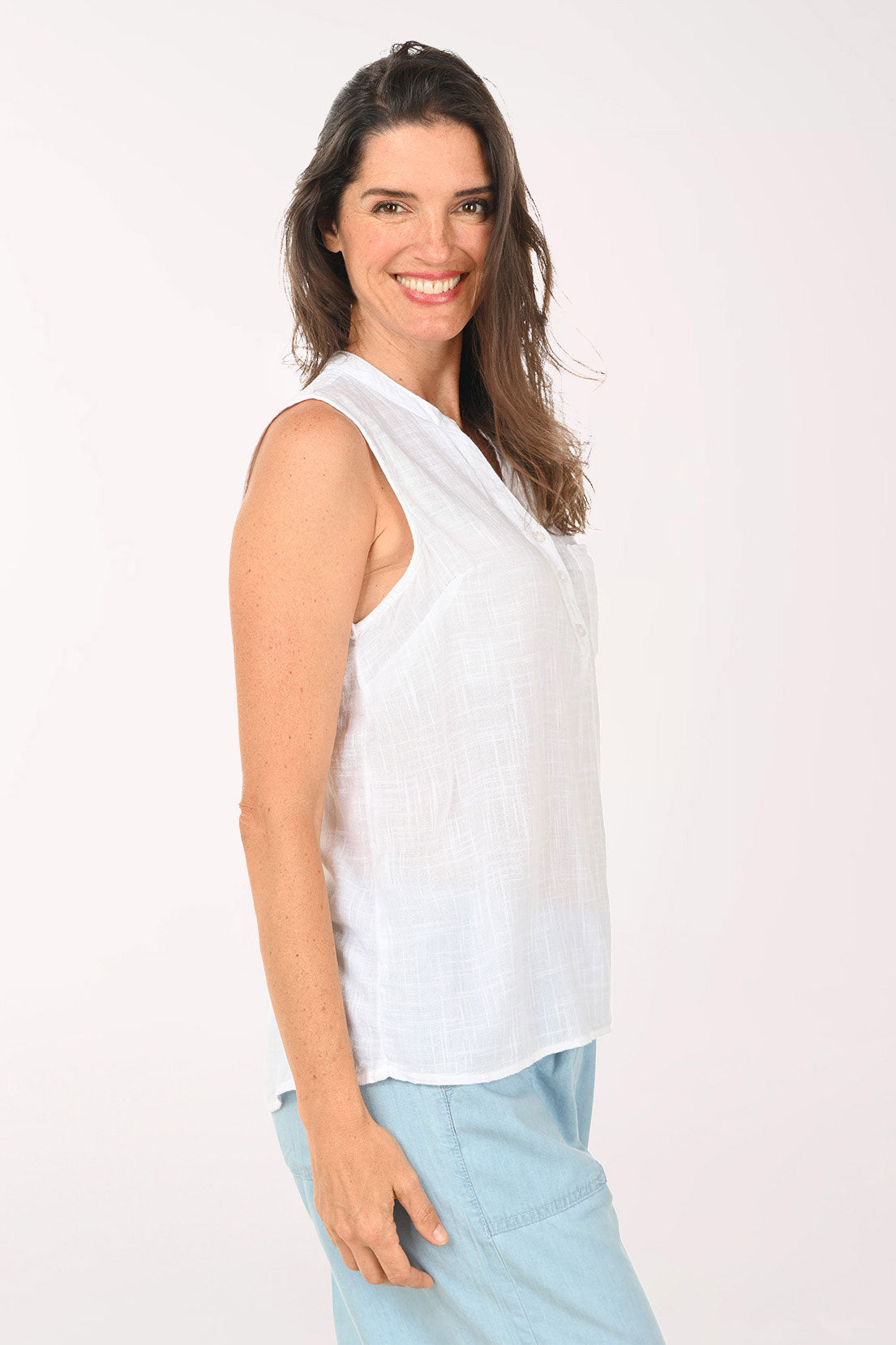 Woman wearing a white sleeveless top