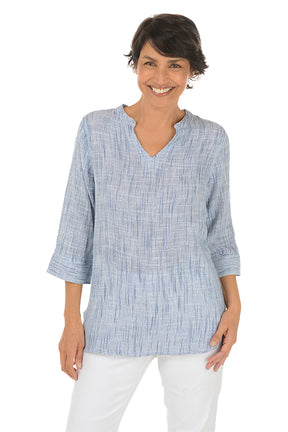 Woman wearing a blue checkered blouse on a white background