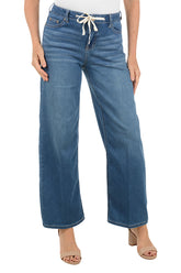 Blue jeans with a drawstring waist on a white background.