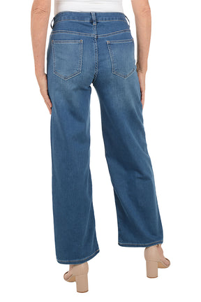 Blue jeans with a drawstring waist on a white background. Back shot.