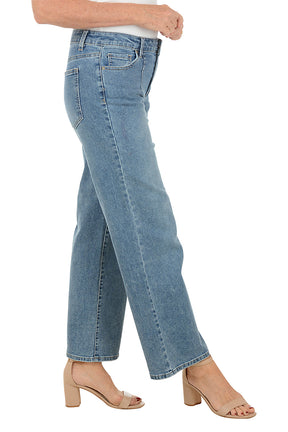 Light blue jeans worn by a person on a white background. Side shot.