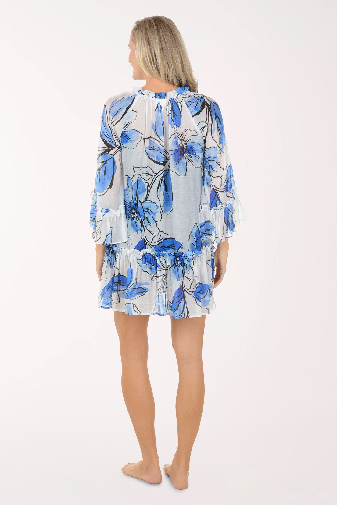 Woman wearing a blue floral dress on a white background