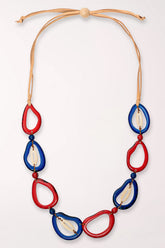 Necklace with red and blue teardrop-shaped pendants on a white background