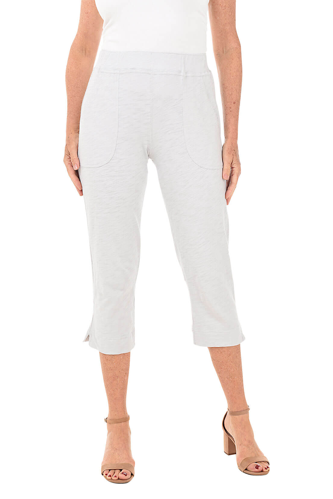 Light grey capri pants worn by a person on a white background- front shot