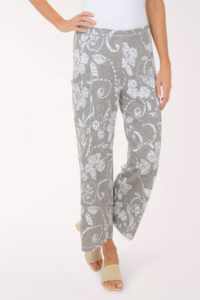 Gray floral-patterned pants worn by a person on a white background