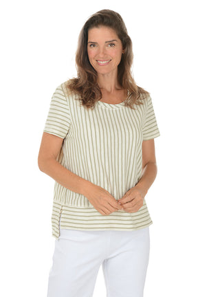 Woman wearing a striped shirt and white pants on a white background.