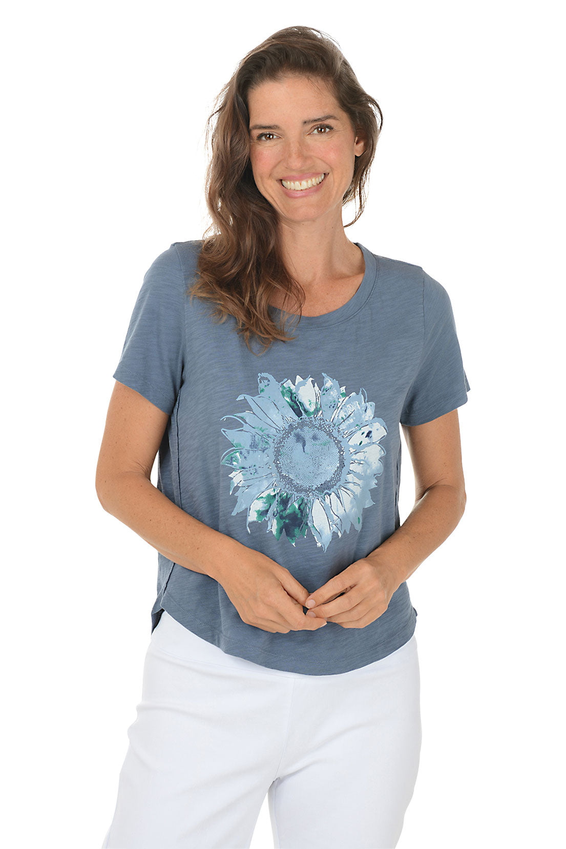 Woman wearing a blue t-shirt with a floral design on a white background.