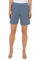 Blue shorts worn by a person on a white background.