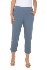 Blue capris worn by a person on a white background.