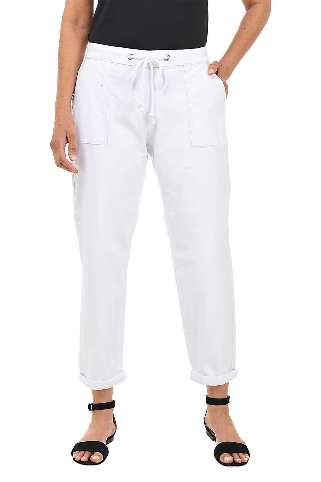 White pants worn by a person on a white background
