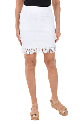 White skirt with fringe hem worn by a person on a white background