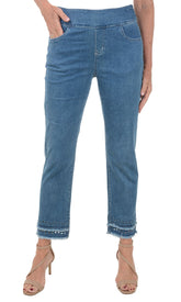 A pair of light blue denim ankle pants with a double tiered fringe hemline and scalloped eyelet embroidery.