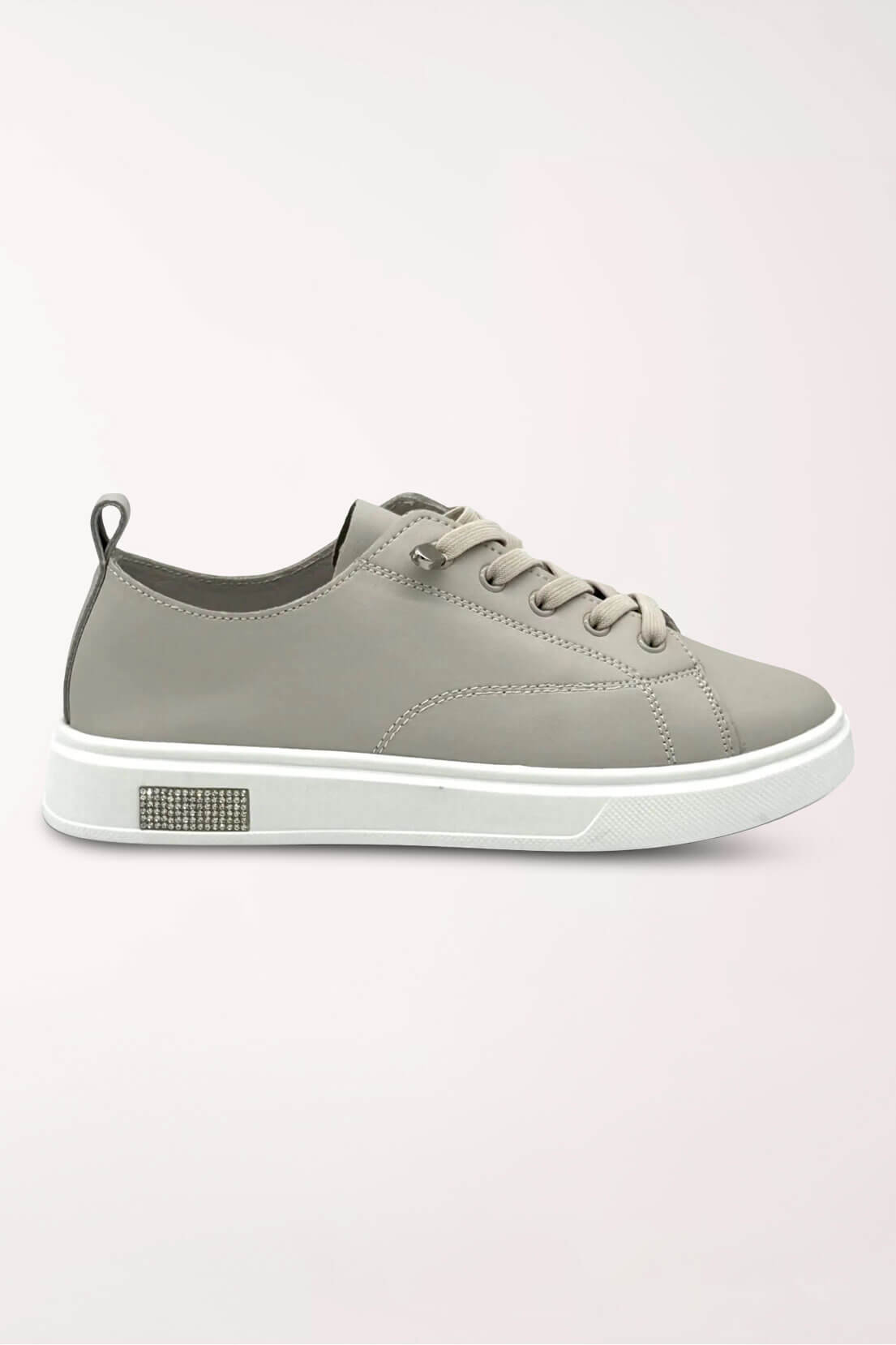 Side profile of the taupe Paros leather sneaker showing the low profile and rhinestone detail on the sole.