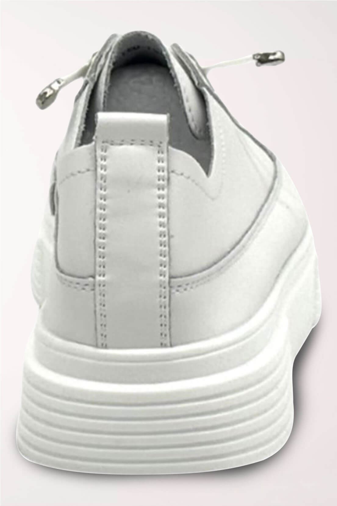 Back view of the white platform sneaker showing the heel pull tab and stacked platform sole.