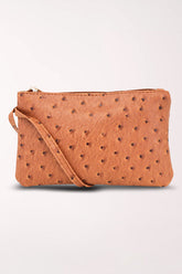 Front view of the 22 Tote Ostrich Wristlet Pouch in camel, a warm tan faux ostrich wristlet pouch with a top zipper and matching wrist strap.