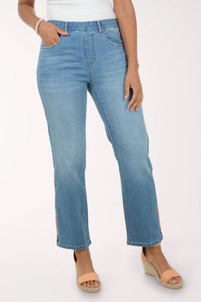 Light blue jeans worn by a person on a white background