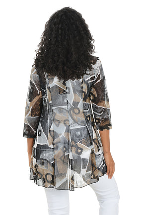 Woman wearing a patterned jacket over a white top on a white background. Back shot.