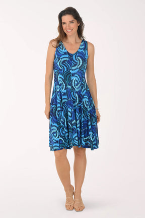 Woman wearing a blue patterned dress on a white background