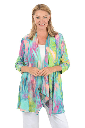 Woman wearing a colorful scarf on a white background.