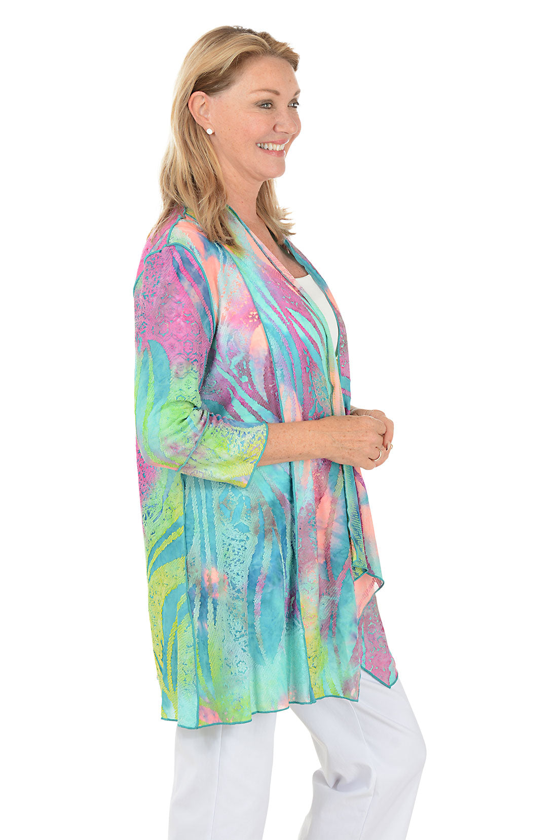 Woman wearing a colorful scarf on a white background. Side shot.