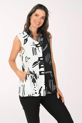 Woman wearing a black and white sleeveless top