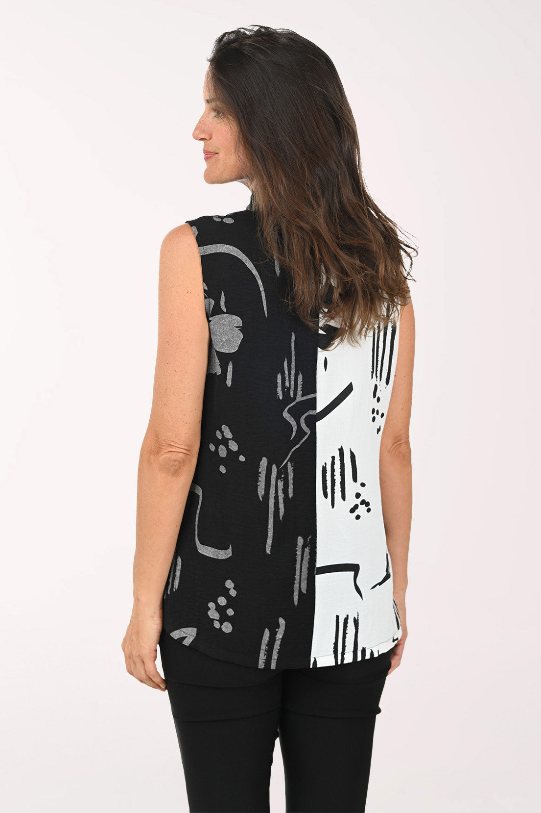 Woman wearing a black and white sleeveless top