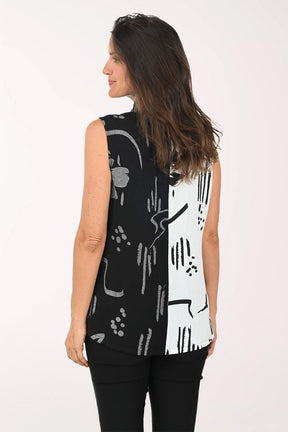 Woman wearing a black and white sleeveless top
