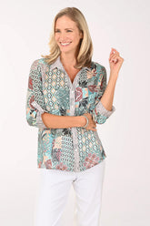 Woman wearing a multi colored roll sleeve top
