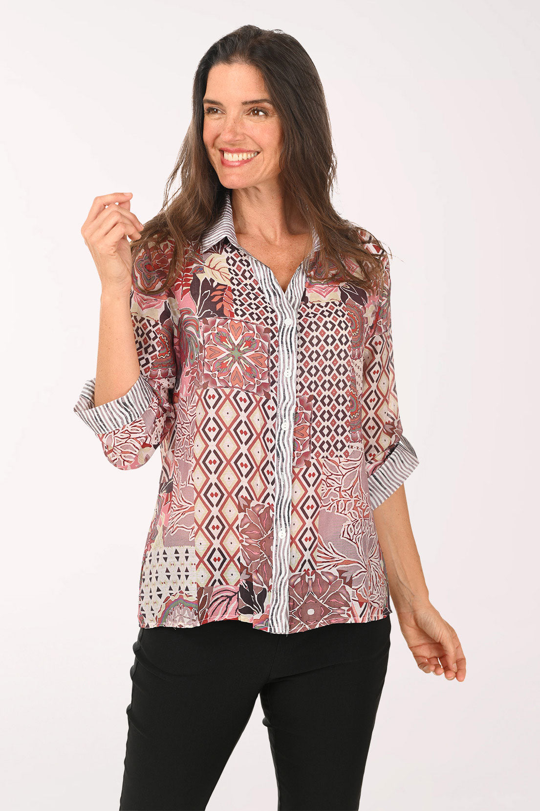 Woman wearing a pink multi roll sleeve top