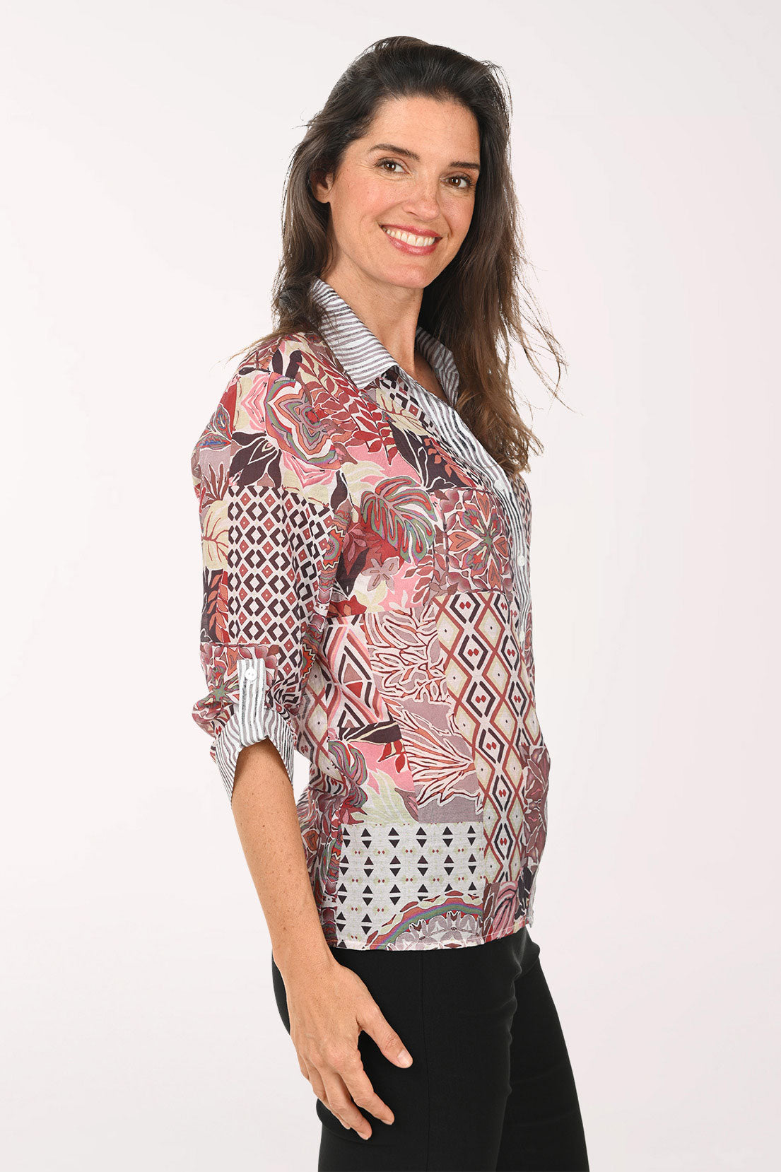 Woman wearing a pink multi roll sleeve top