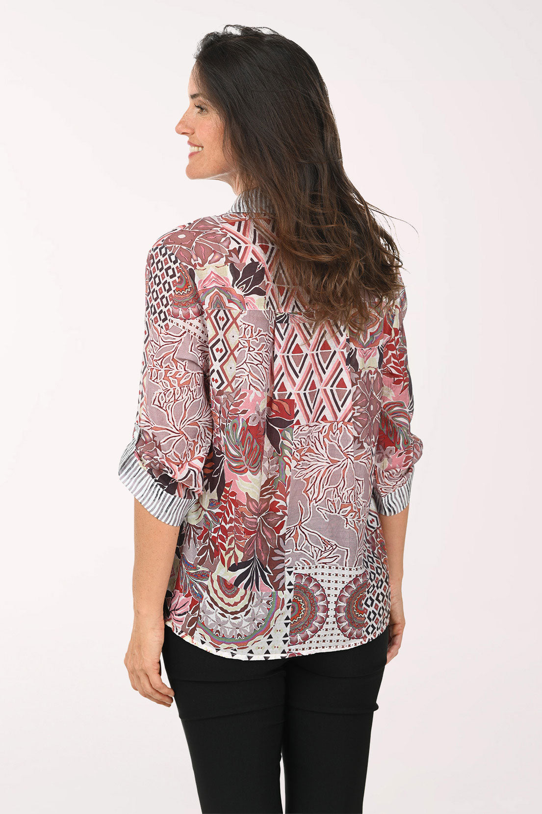 Woman wearing a pink multi roll sleeve top