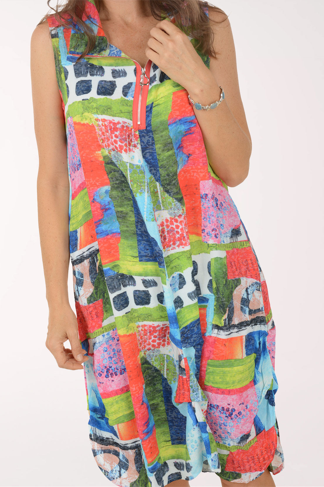 Woman wearing a colorful patterned dress on a white background