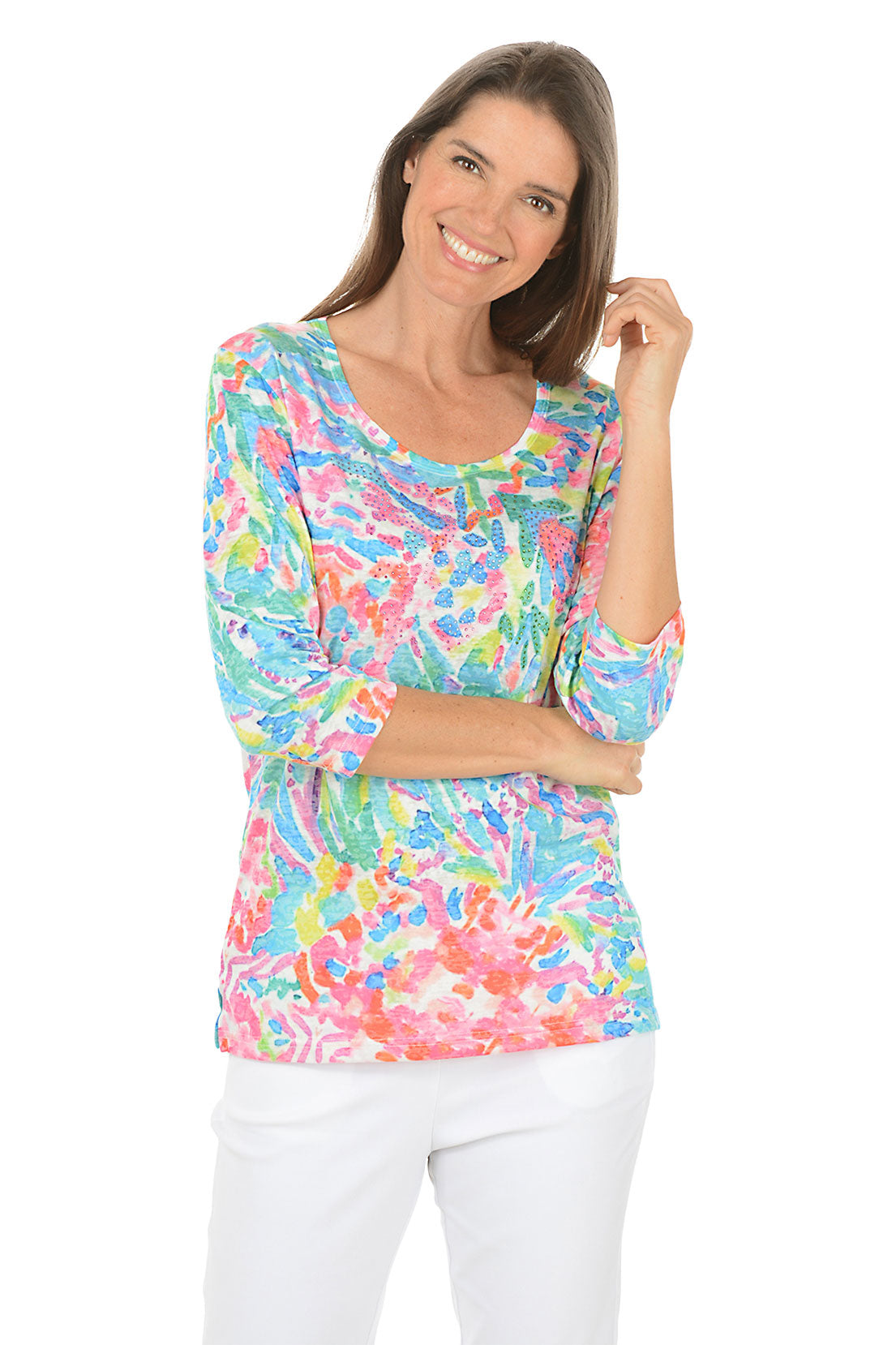 Woman wearing a colorful patterned top on a white background. Second front shot.