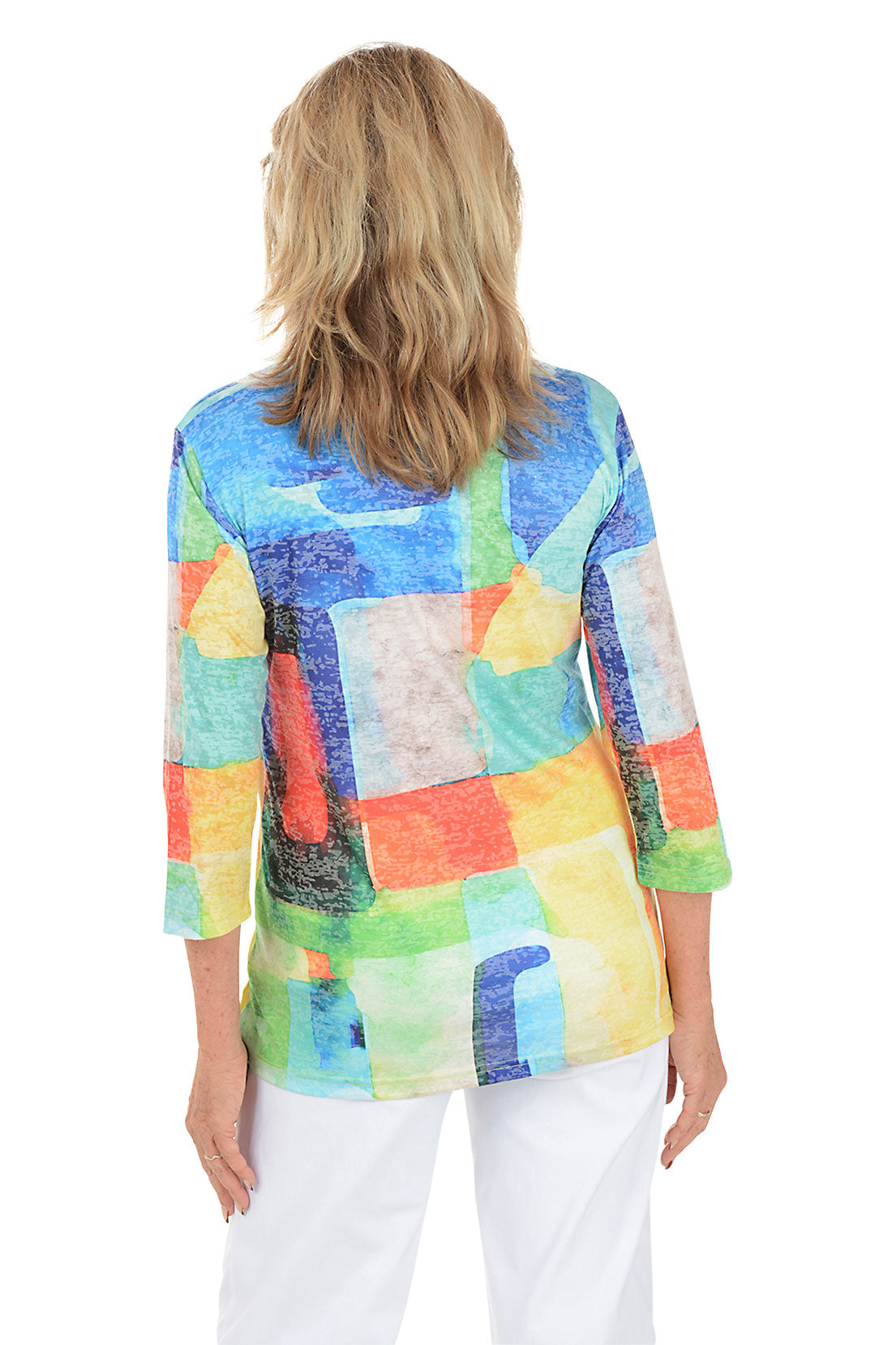 Woman wearing a colorful patchwork sweater on a white background. Back shot.