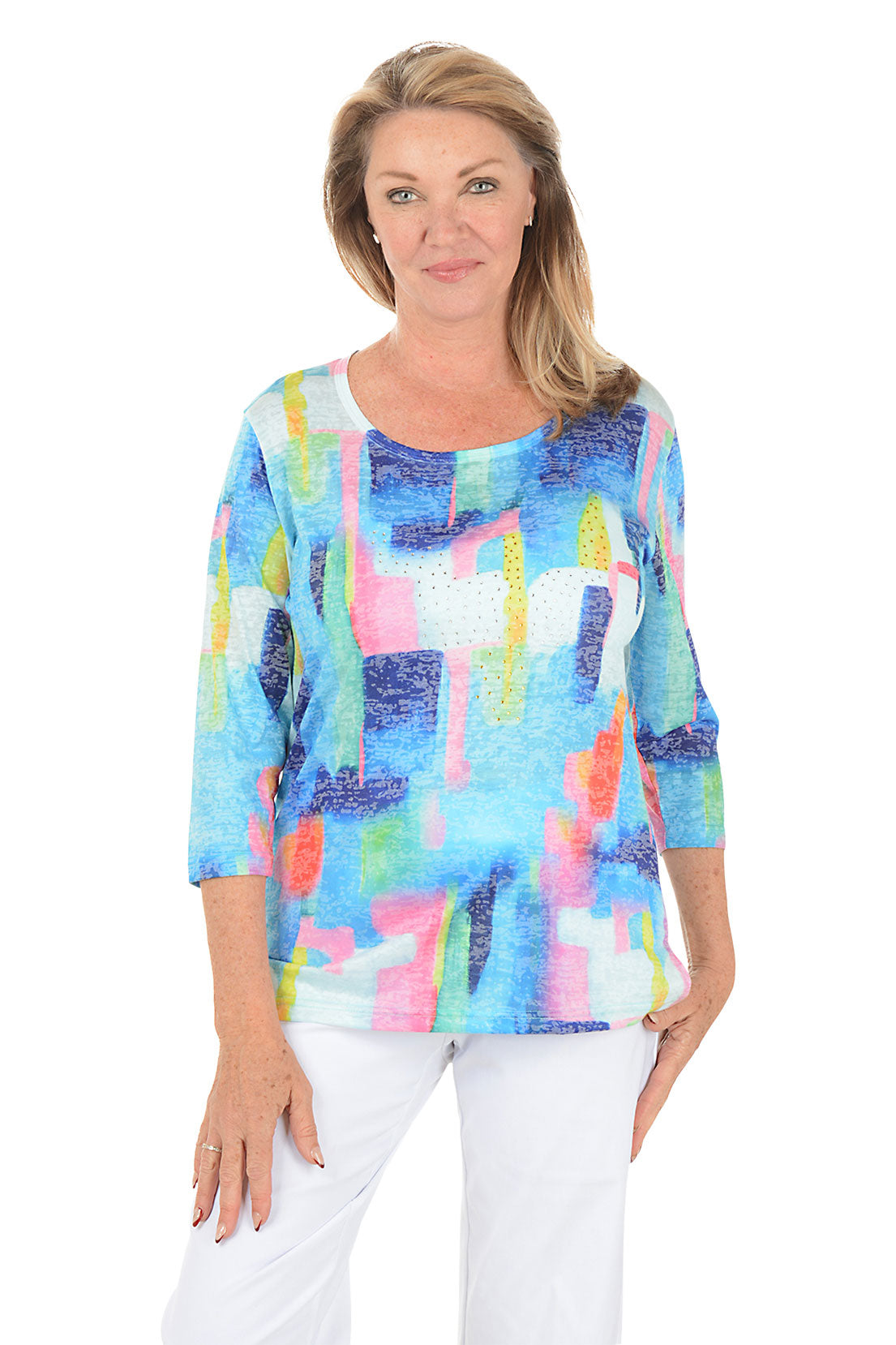 Woman wearing a colorful abstract patterned top on a white background.