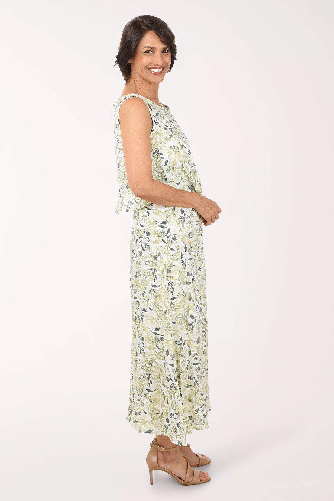 Woman wearing a floral dress on a white background