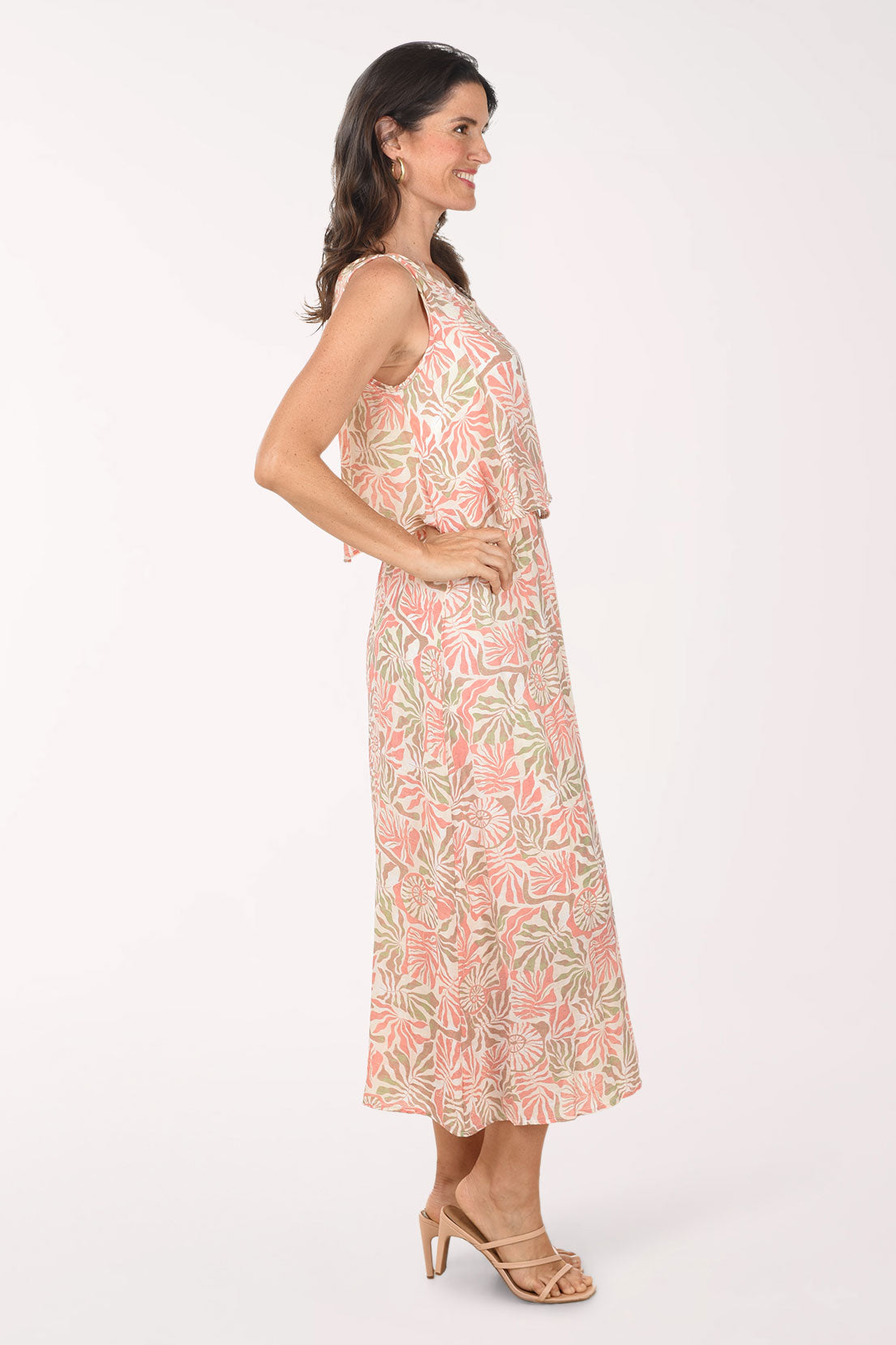 Woman wearing a floral dress on a white background