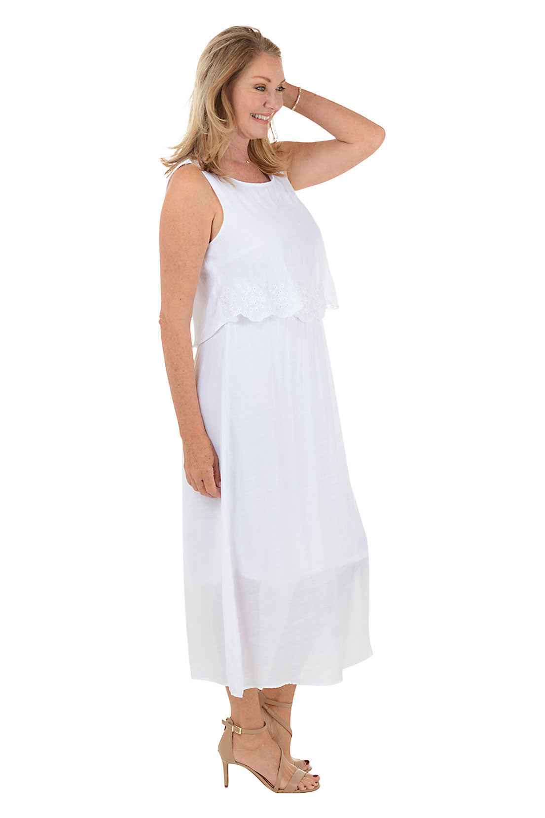 Woman wearing a white sleeveless dress on a white background