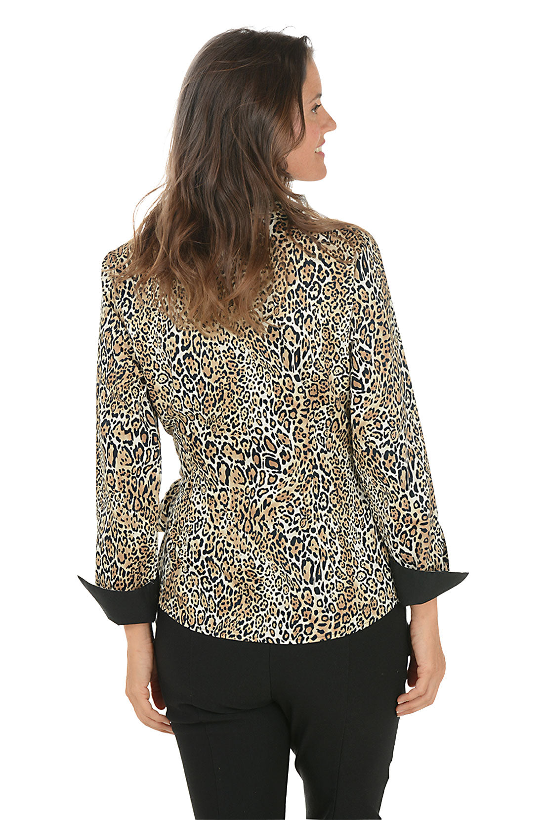 A woman wearing a leopard patterned blouse with a collar and side tie. Back shot.