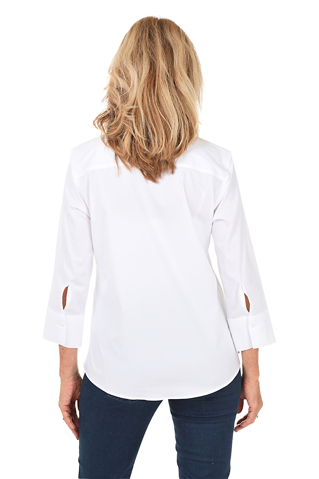 Woman wearing a white shirt and jeans against a white background. Back shot.