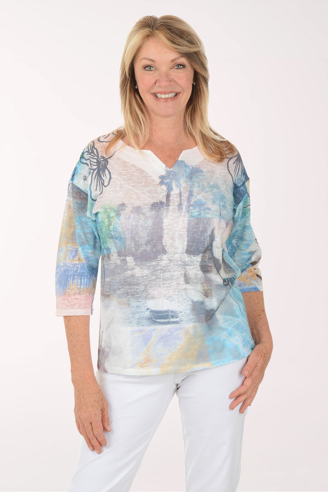 Woman wearing a colorful blouse with a white background