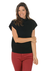 Woman wearing a black sleeveless top and red pants on a white background.