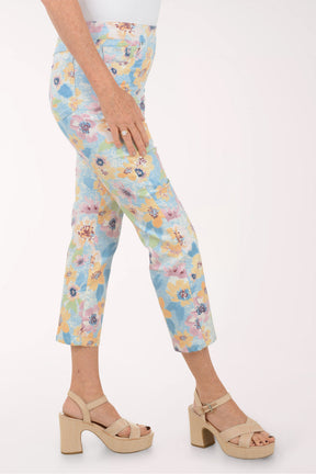 Floral-patterned pants worn by a person on a white background
