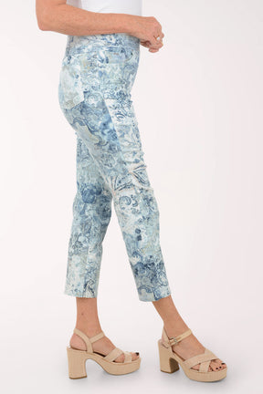 Person wearing blue patterned pants on a white background