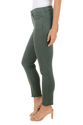 Person wearing green ankle jeans on a white background. Side shot.