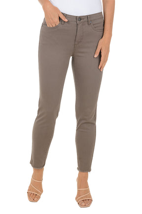 Person wearing grey pants on a white background