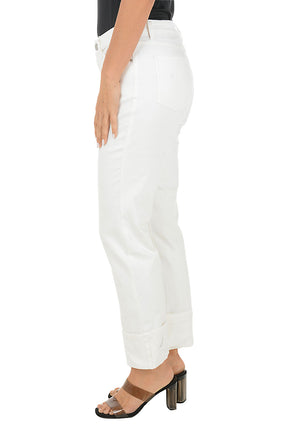 Person wearing white denim jeans on a white background. Side shot.