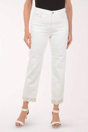 Person wearing white jeans with lace trim on a white background