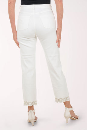 Person wearing white jeans with lace trim on a white background