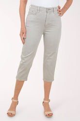 Woman wearing a grey capri pant.